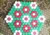 Covor dopuri de plastic, Inedit, tip hexagon, lucrat manual , model floral ,culori vii