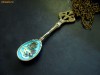 Colier steampunk  (lant lung), in forma de lingurita; culori: bronz, albastru  (realizat din piese de ceas prinse in rasina) Unicat